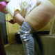 A hidden camera records a fat, mature, Eastern-European woman bending over in front of a steel street toilet and taking a dump. Poop action is clearly seen from her rear. See movies 11817 and 11828 for more. Presented in 720P HD. Over 3 minutes.